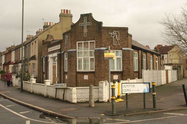 Streatham Vale Baptist Church, a brick building with a cross and an angel in relief, on the corner of Leonard Road and Juniper Gardens